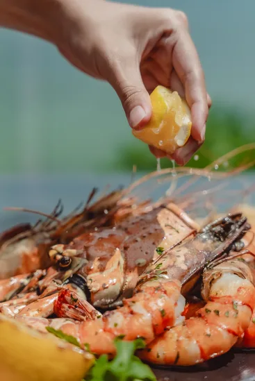 Grilled prawns with a squeeze of fresh lemon