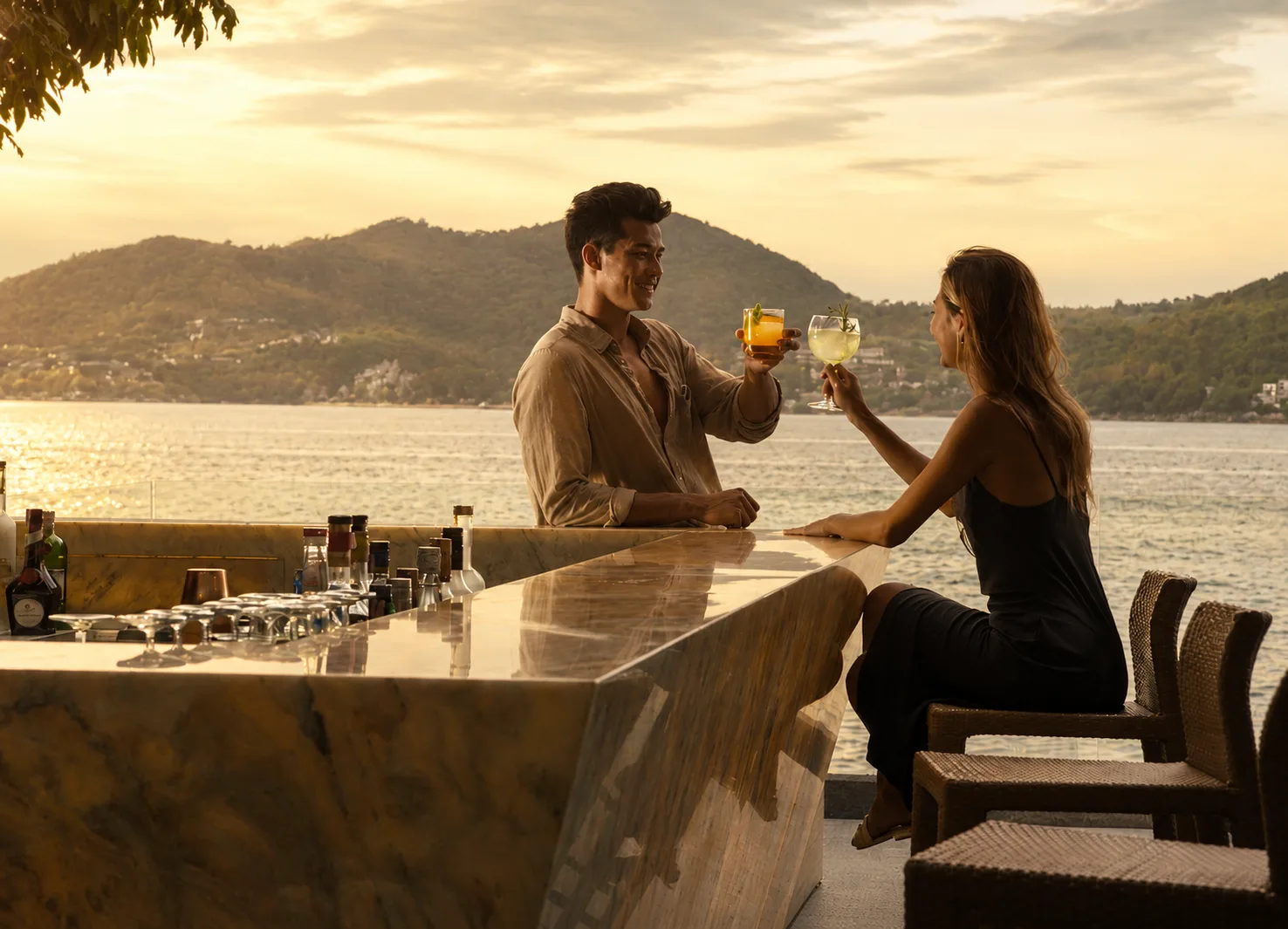 Couple enjoying cocktails at the seaside marble bar